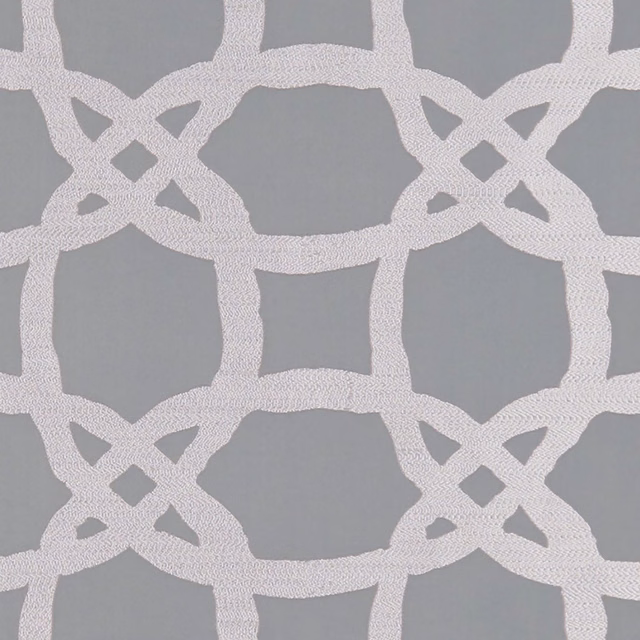 Cool pewter grey textile with a textured ivory interlocking lattice motif