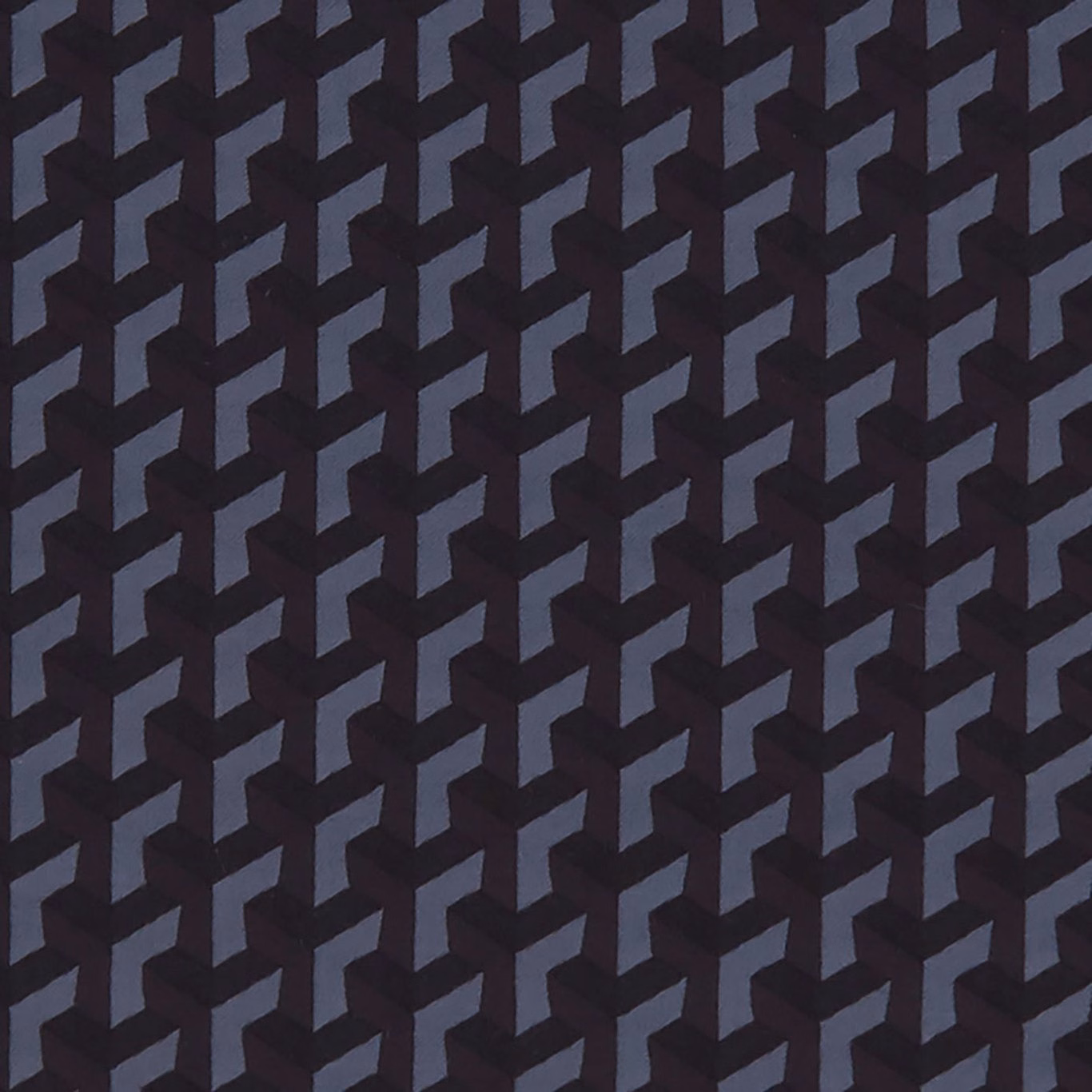 Black textile with slate-blue interlocking angular geometric motif