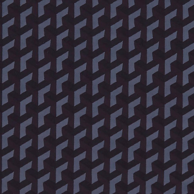 Black textile with slate-blue interlocking angular geometric motif