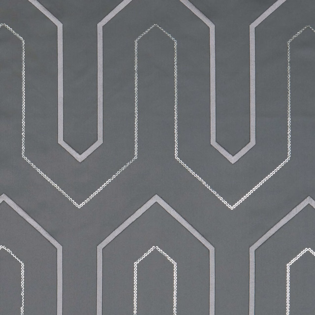 Cool charcoal fabric with pale geometric arches and dotted inner outlines