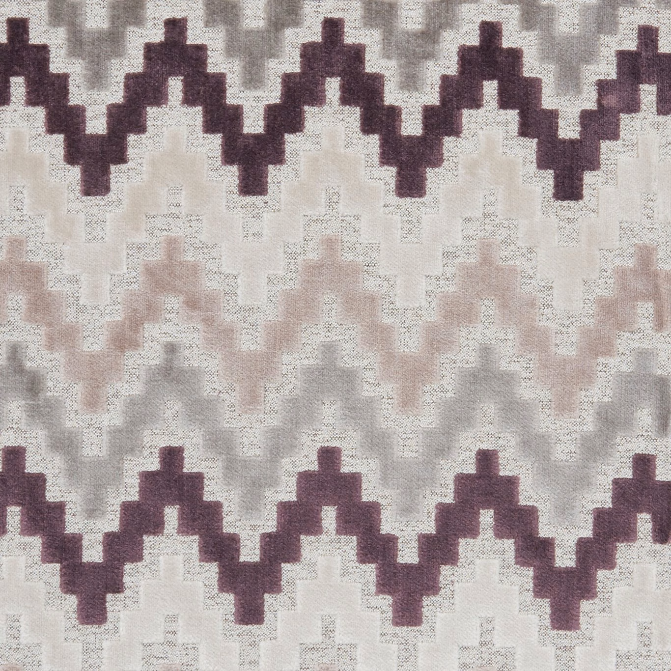 Empire Damson textile showing plum stepped zigzags over blush, grey and ivory ground