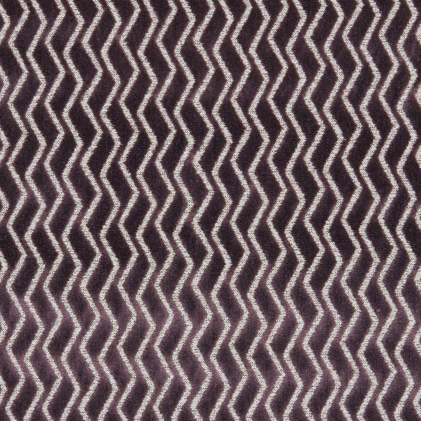 Deep damson woven fabric with pale cream zigzag chevrons and tactile texture