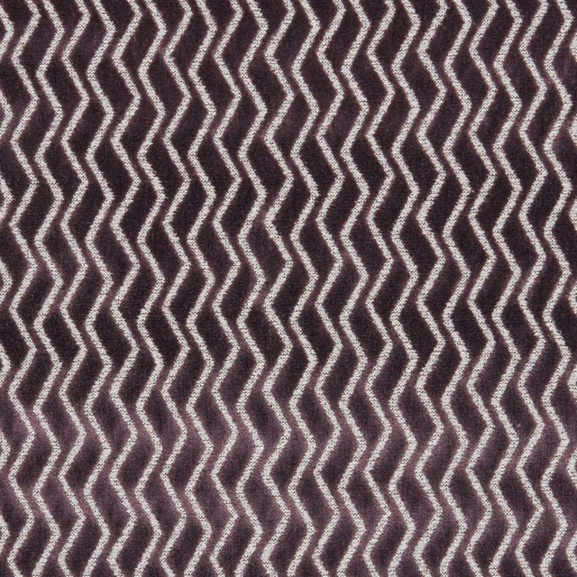 Deep damson woven fabric with pale cream zigzag chevrons and tactile texture