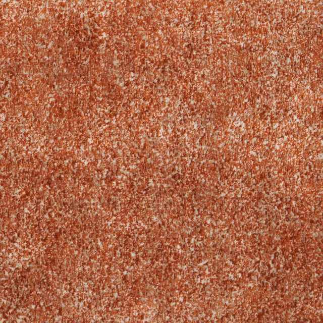 Warm rust terracotta upholstery weave with cream flecks and softly mottled texture