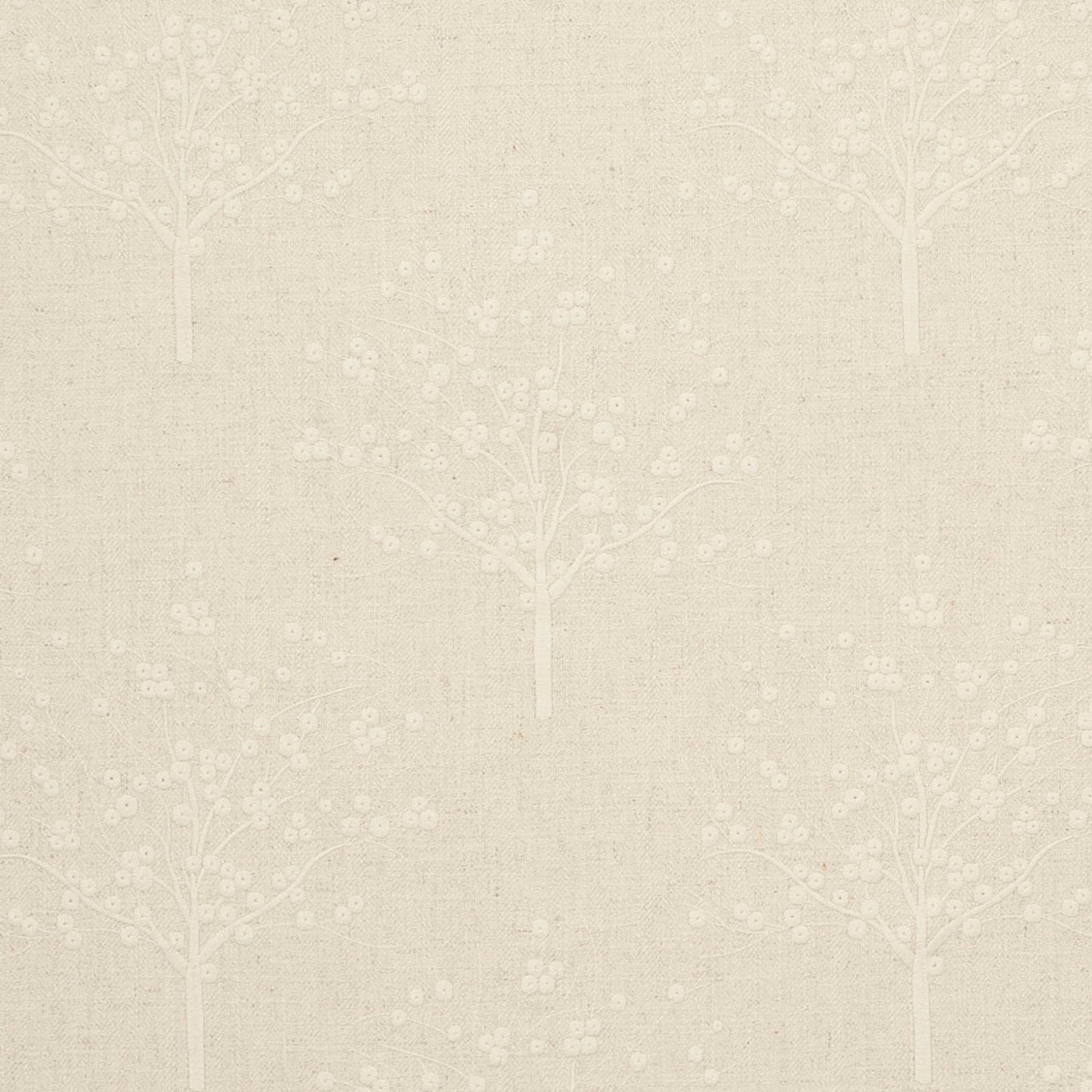 Warm beige woven fabric with pale flowering tree motifs and scattered blossom dots