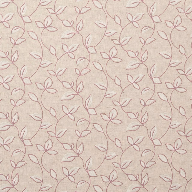 Blush woven fabric with dusty orchid flowering vines and fine cream texture
