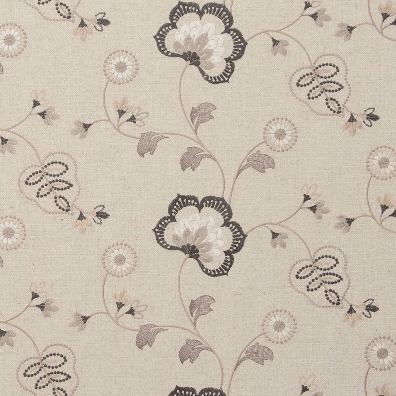 Warm charcoal floral trails and dotted petals on a pale woven ground