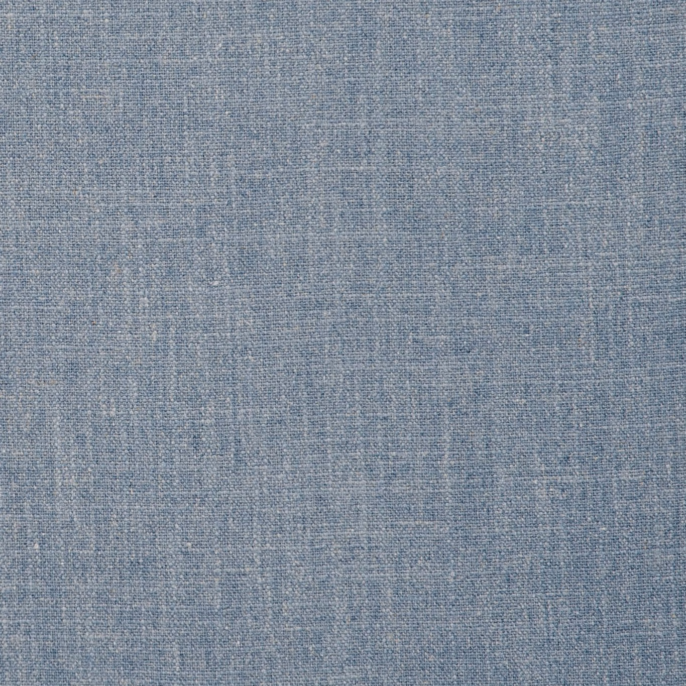 Mottled chambray-blue woven textile with fine pale crosshatch texture