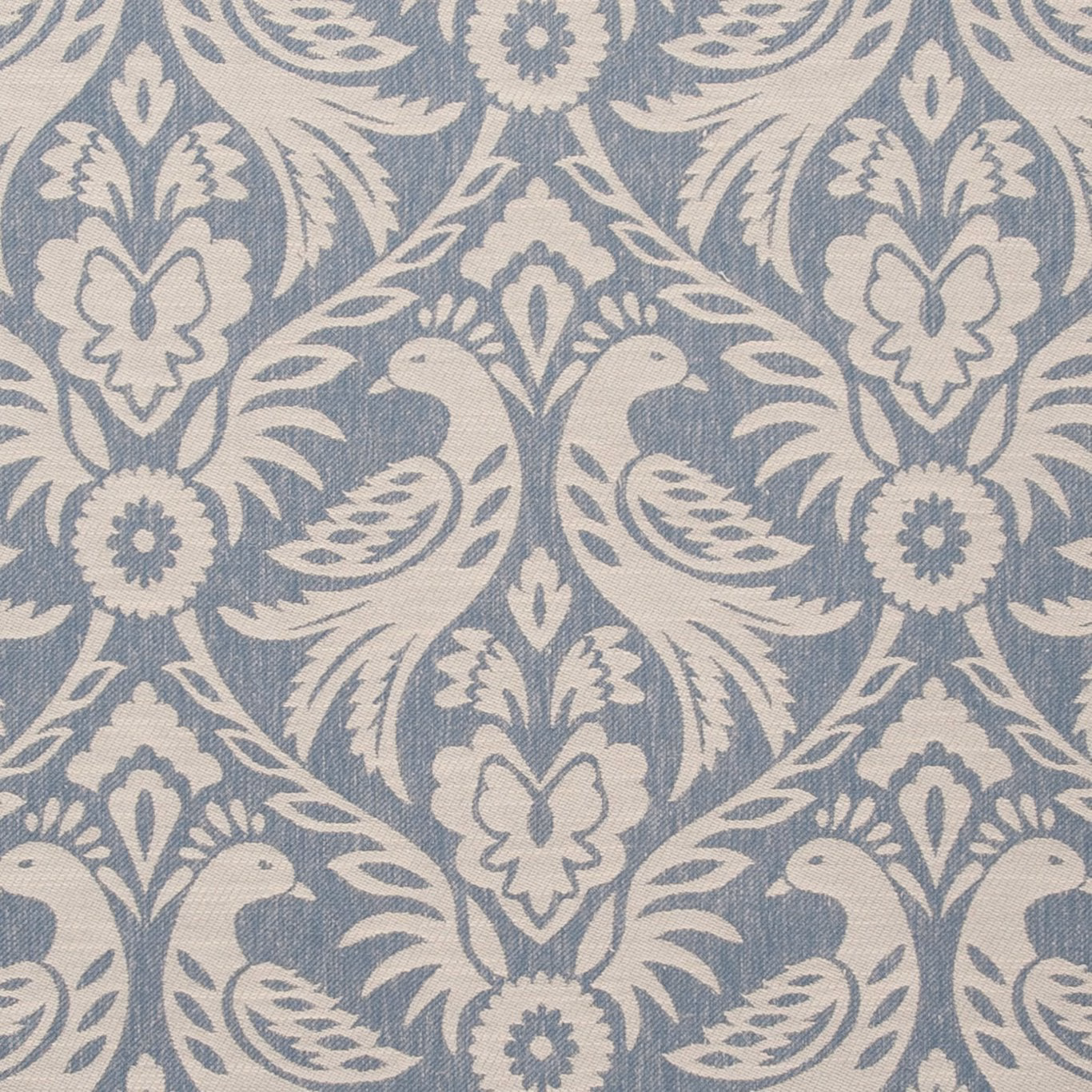 Muted chambray blue fabric with cream damask flowers, birds and leafy scrolls