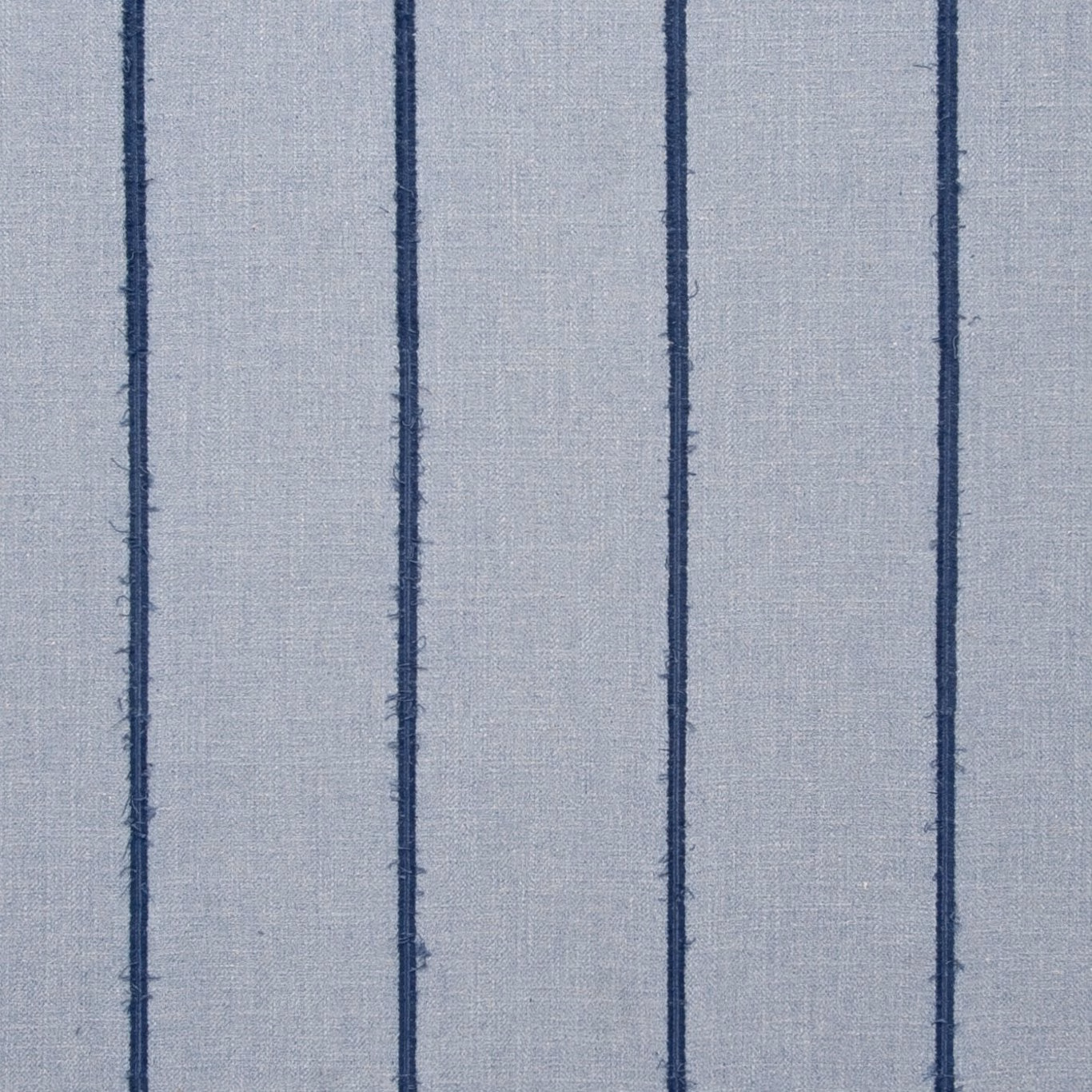 Pale blue-grey woven chambray with narrow irregular navy vertical stripes