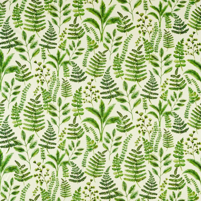 Cream fabric covered with layered fern fronds and varied fresh green leafy stems