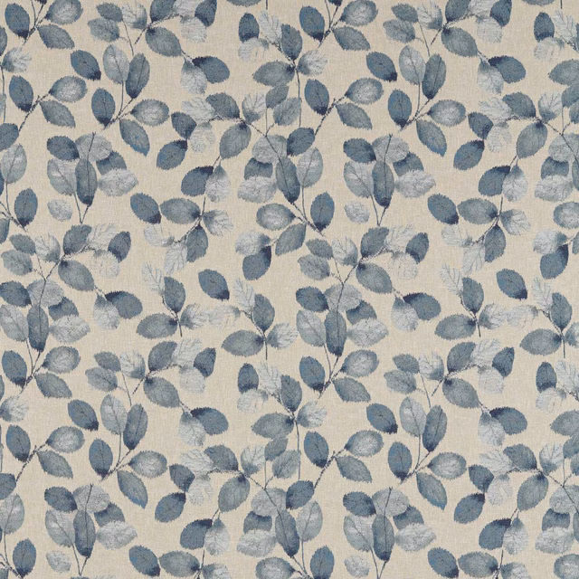 Denim-blue leafy branches scattered across a softly textured linen-toned woven ground