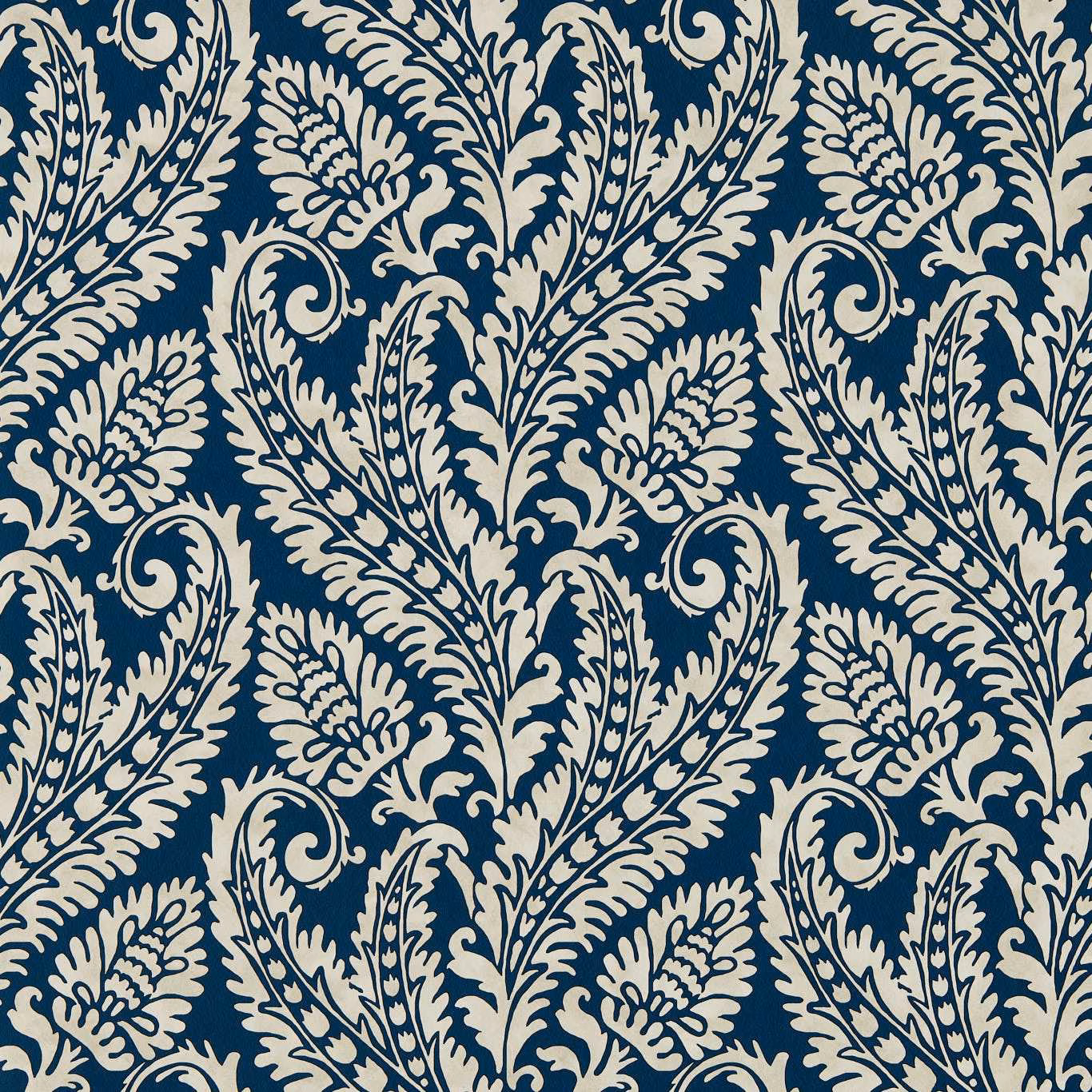 Deep denim-blue wallpaper with ivory scrolling leaves, flowers and curling botanical paisley motifs