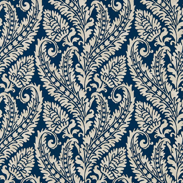 Deep denim-blue wallpaper with ivory scrolling leaves, flowers and curling botanical paisley motifs