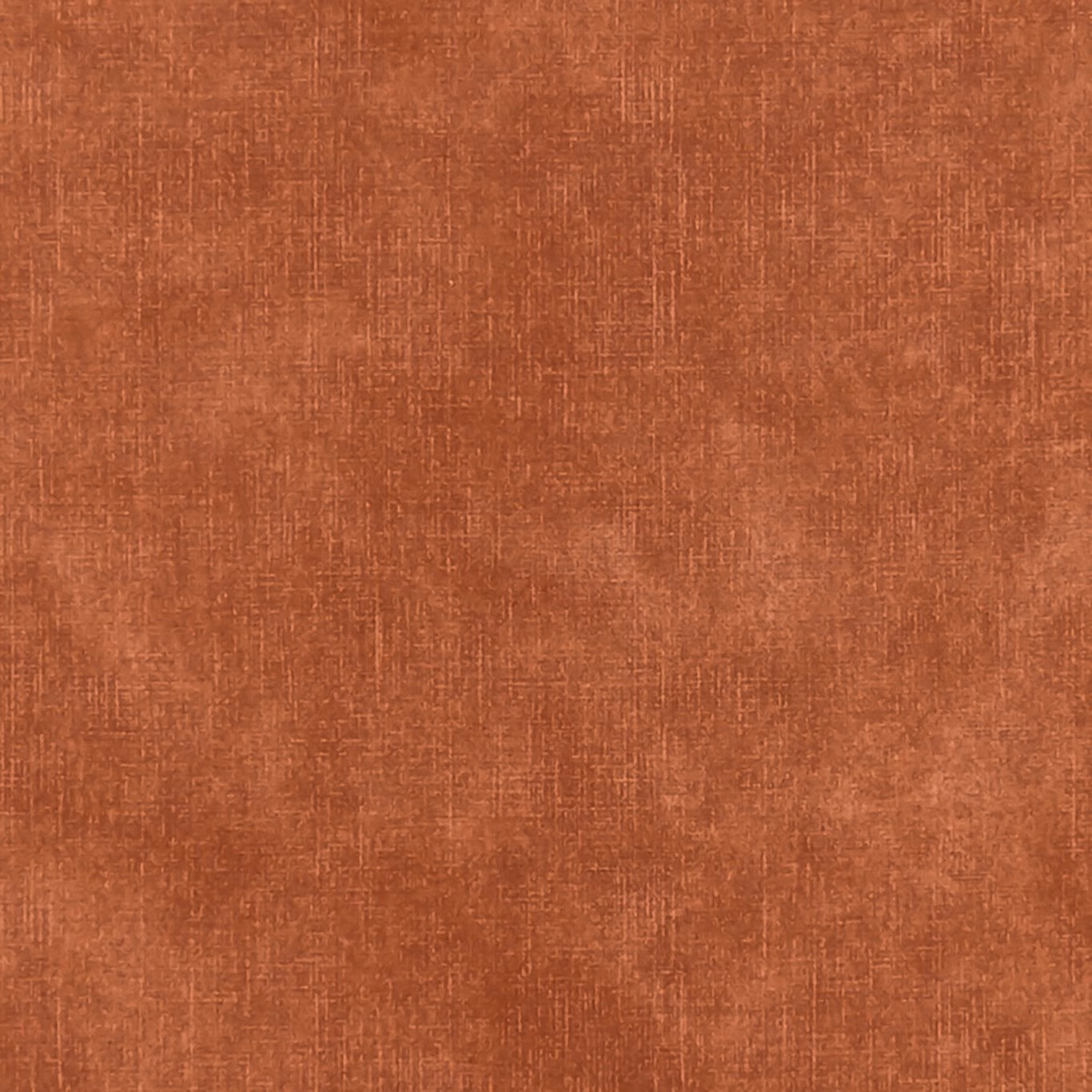 Warm flame terracotta fabric with a softly irregular crosshatched woven surface