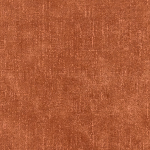 Warm flame terracotta fabric with a softly irregular crosshatched woven surface
