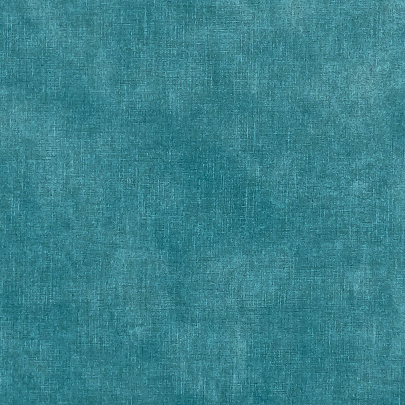Close-up of cool jade-teal woven fabric with softly mottled crosshatched texture
