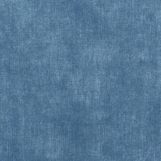 Close-up of muted ocean-blue woven fabric with subtly mottled vertical texture