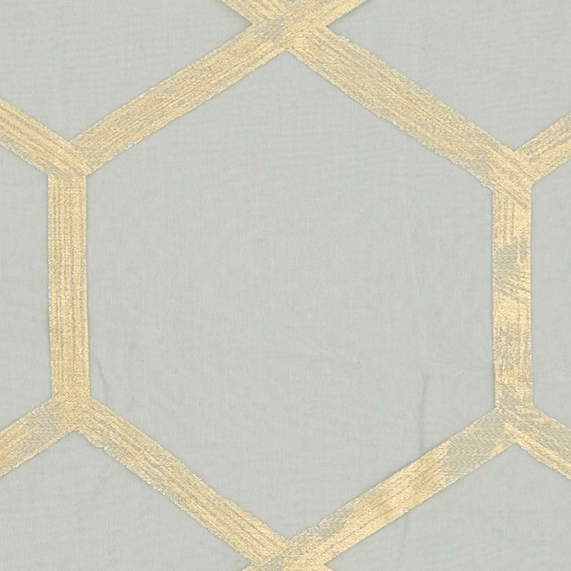 Pale charcoal-grey textile with textured gold hexagonal lattice bands