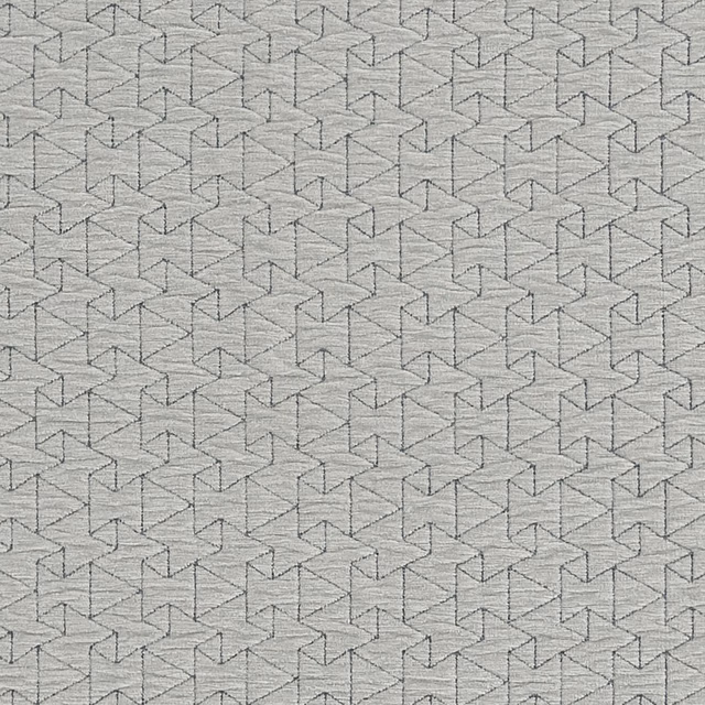 Cool dove-grey woven textile with fine interlocking angular cube motifs
