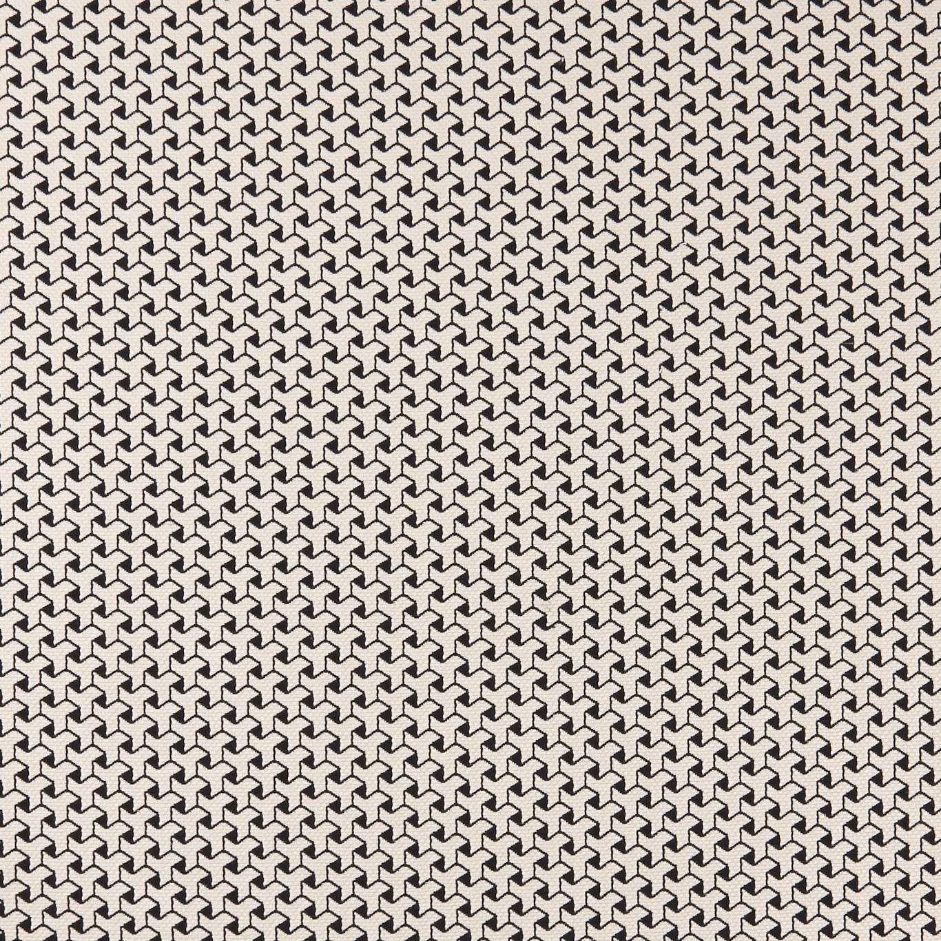 Black and ivory woven fabric with a dense small-scale interlocking geometric pattern