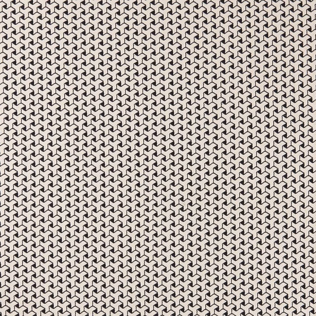 Black and ivory woven fabric with a dense small-scale interlocking geometric pattern