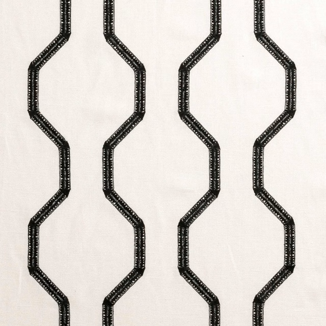 Ivory woven fabric with near-black angular chain bands in a vertical repeat