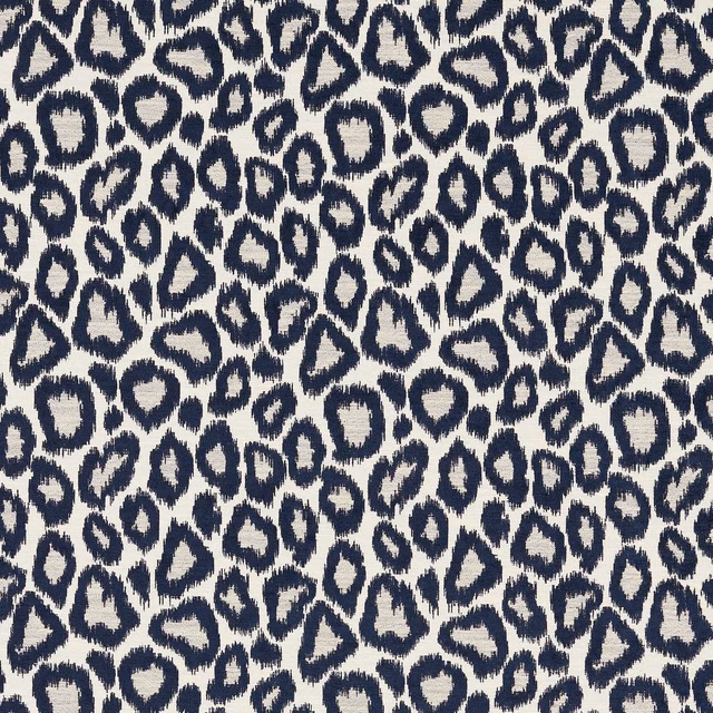 Ink navy irregular animal spots on an ivory, subtly textured woven ground