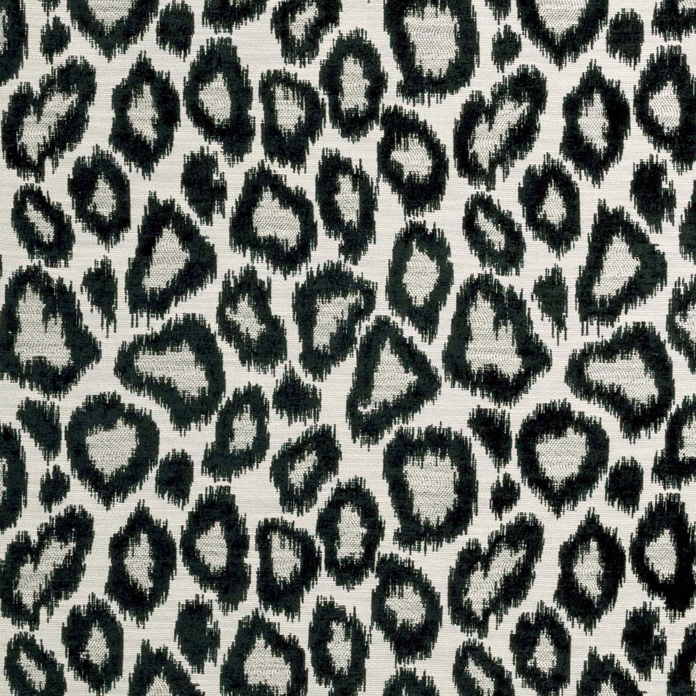 Ivory woven ground with irregular black leopard-like rings and softly frayed edges