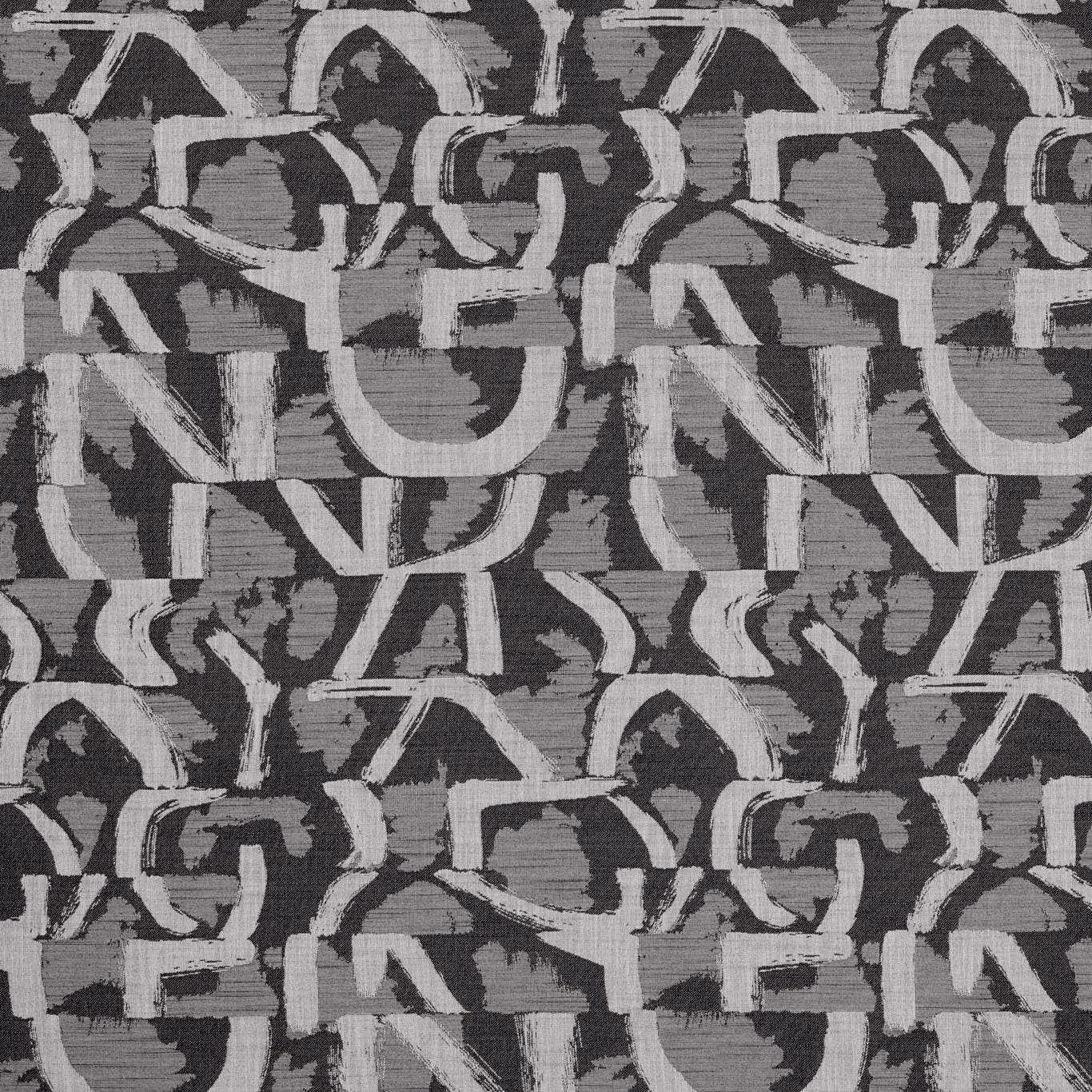 Charcoal jacquard with chalk-grey abstract interlocking motifs and a textured woven surface