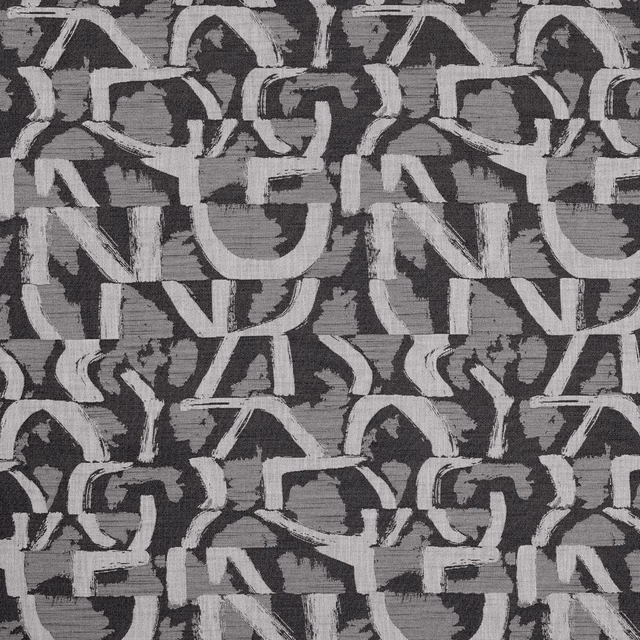Charcoal jacquard with chalk-grey abstract interlocking motifs and a textured woven surface