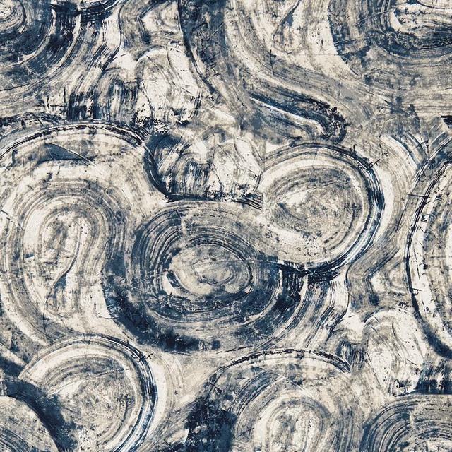 Ink-blue and cream wallpaper with layered circular, distressed brushstroke motifs