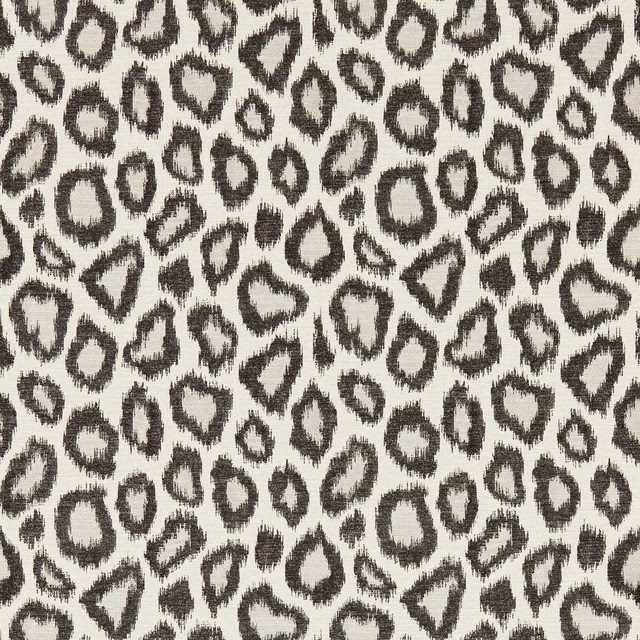 Ivory wallpaper with dense charcoal irregular animal spots and painterly edges