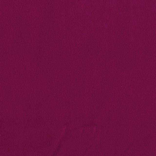 Close-up of deep fuchsia magenta fabric with a softly brushed, subtly shaded surface