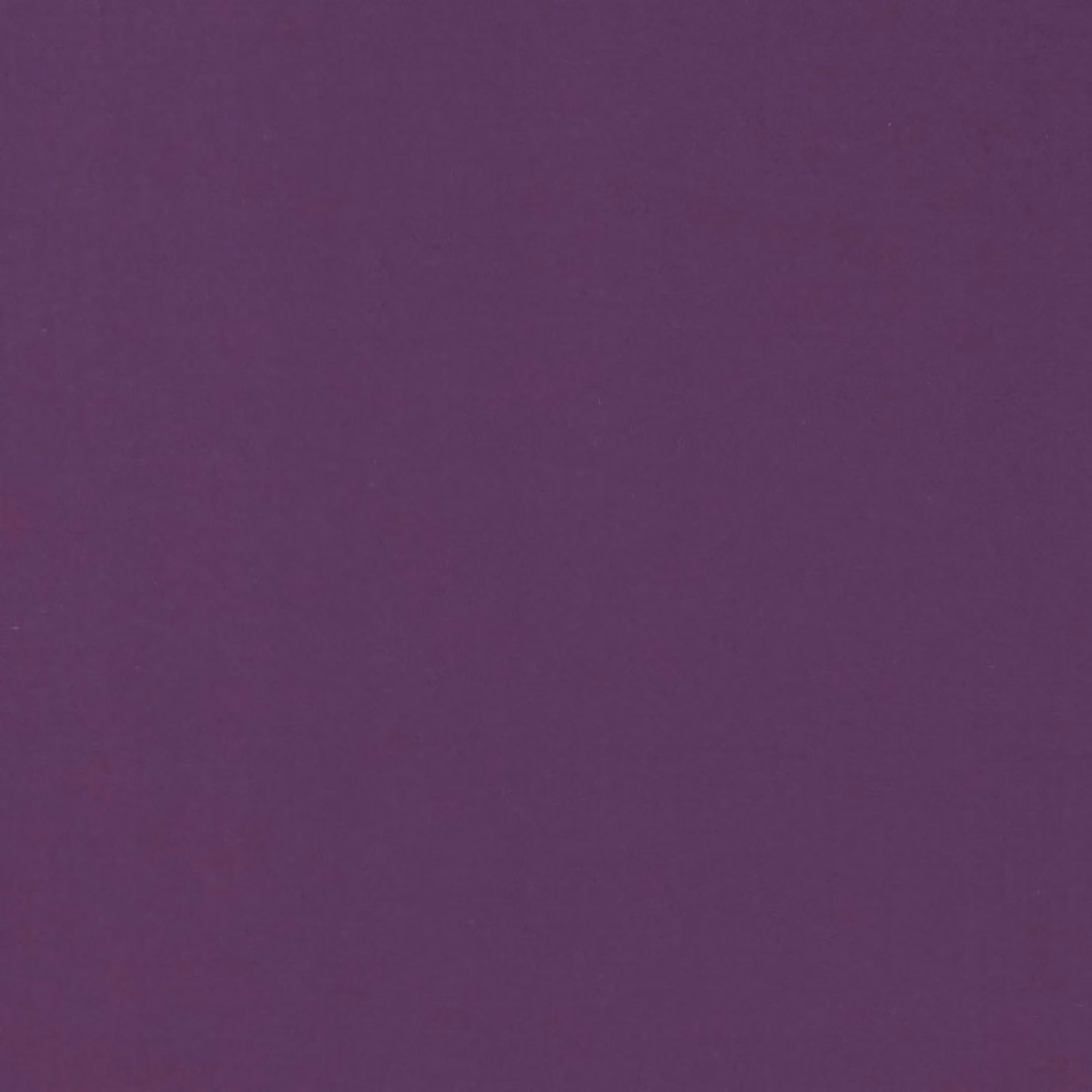 Close-up of deep berry-purple plain fabric with a subtle fine woven texture