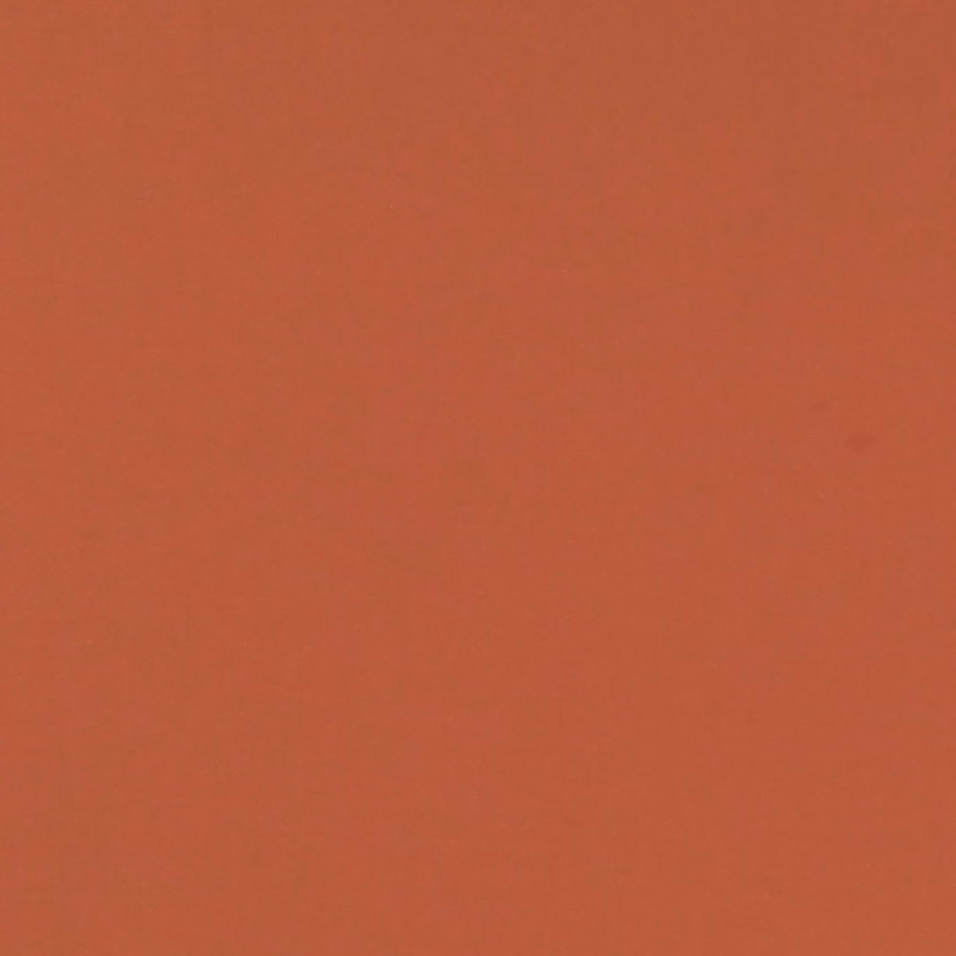 Warm cinnamon terracotta plain fabric with a subtly textured matte surface