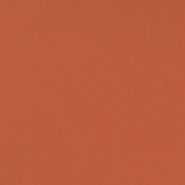 Warm cinnamon terracotta plain fabric with a subtly textured matte surface