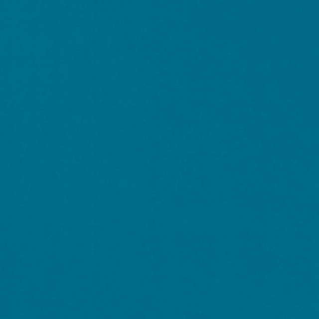 Close-up of deep peacock teal plain weave with a softly mottled surface