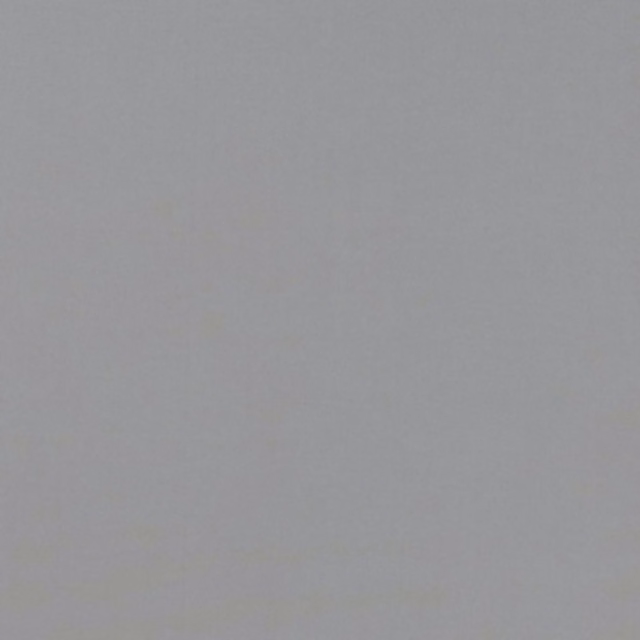 Close-up of cool pewter-grey plain weave with a softly mottled surface