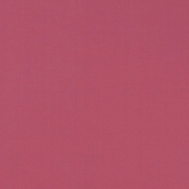 Close view of plain deep ruby-red fabric with a softly mottled fine weave