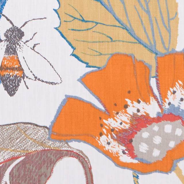 Orange and ochre botanical flowers with blue outlines on a pale textured fabric