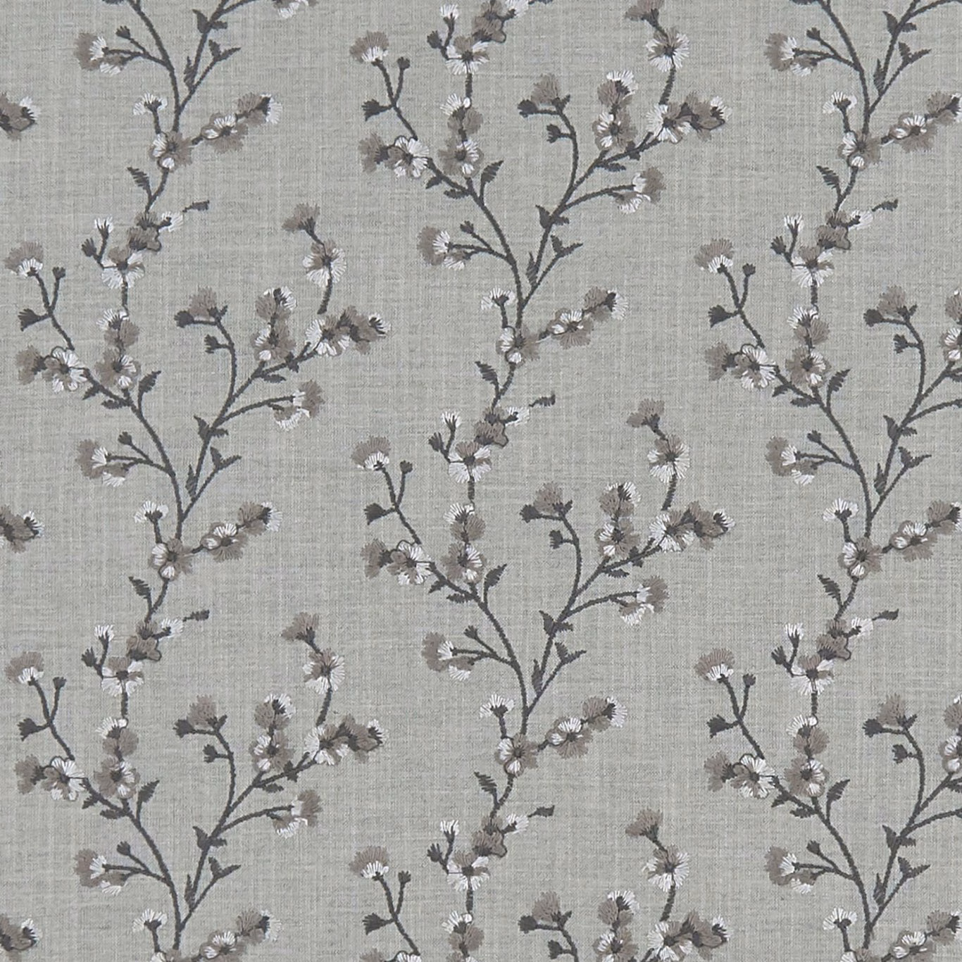 Cool grey woven ground with charcoal flowering branches and tiny pale blossoms