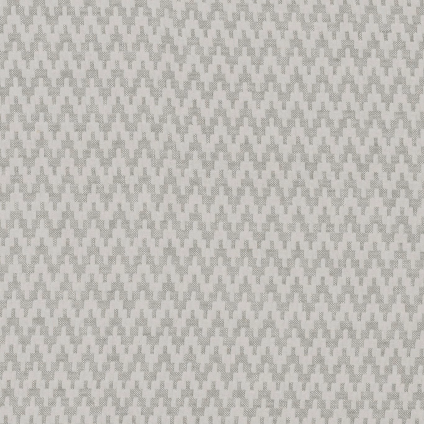 Cool silver-grey woven fabric with tiny stepped zigzag motifs and subtle texture