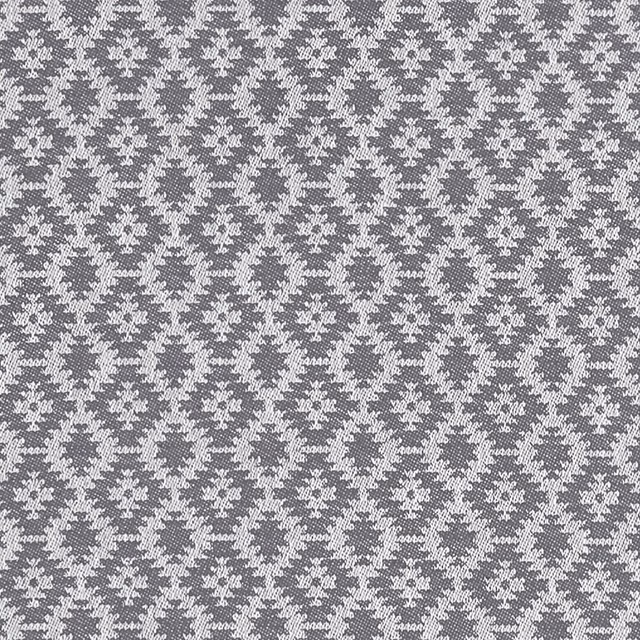 Charcoal grey woven ground with tiny pale floral motifs in a tight repeat
