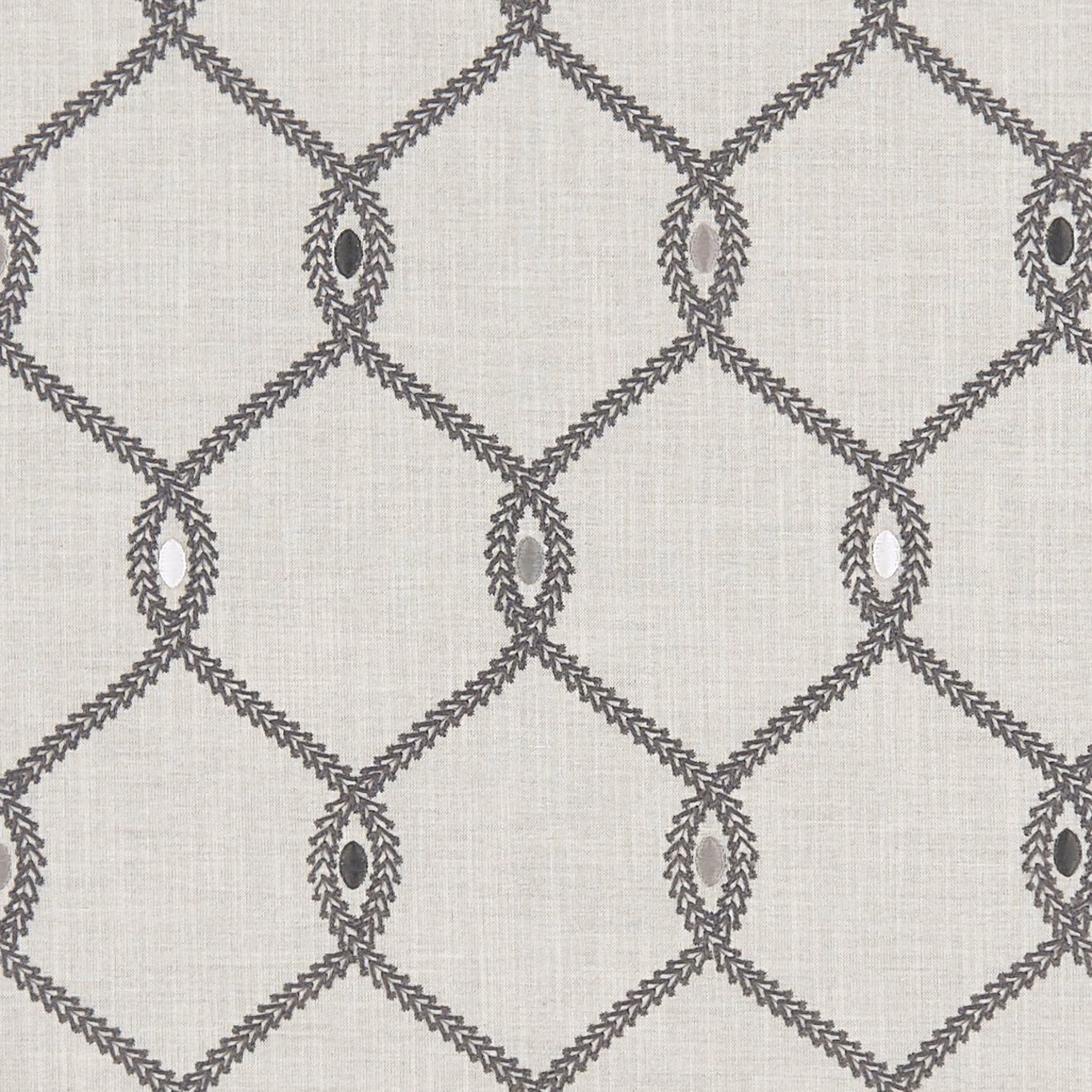 Cool grey textile with charcoal diamond lattice and leaf-edged oval motifs