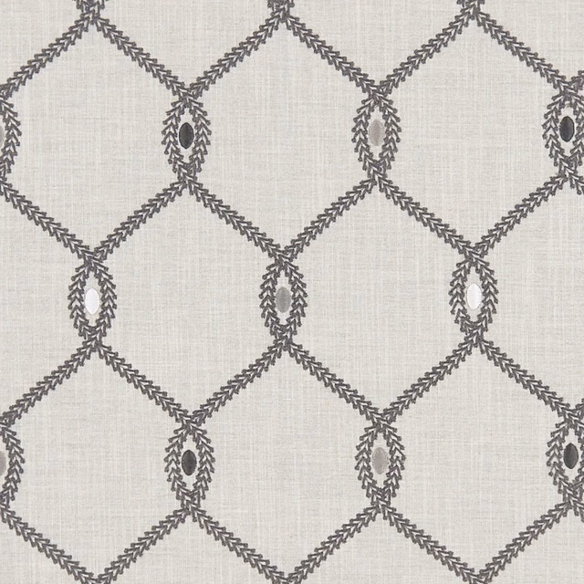 Cool grey textile with charcoal diamond lattice and leaf-edged oval motifs