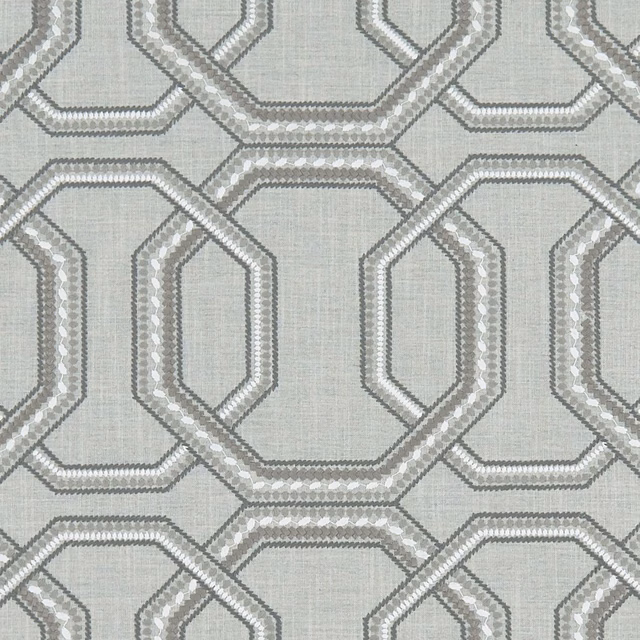 Cool silver-grey woven fabric with interlocking octagonal outlines and pale textured ground