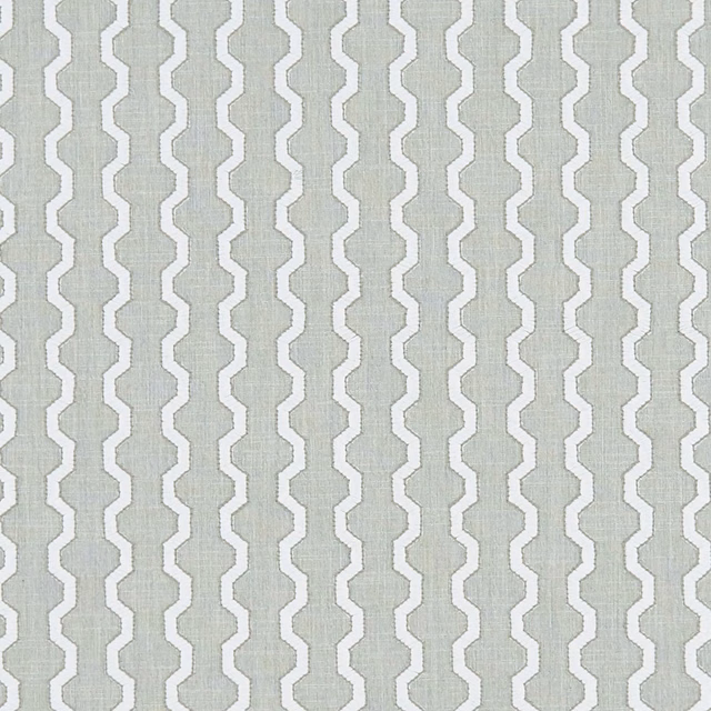Silver-grey woven fabric with white stepped zigzag stripes and fine texture