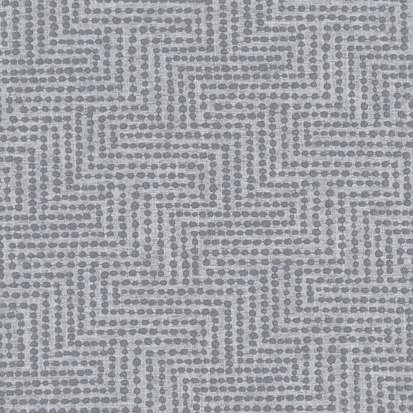 Cool charcoal grey woven fabric with a dotted stepped maze pattern