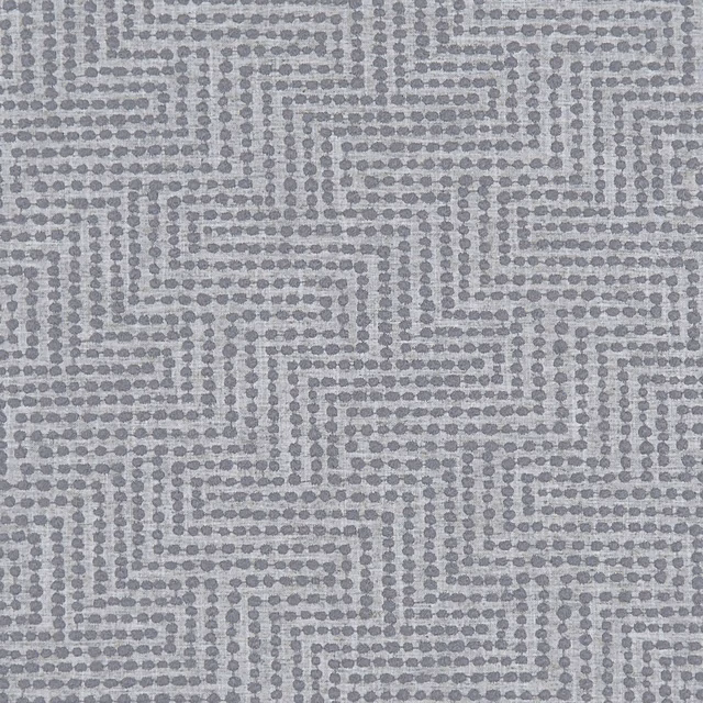 Cool charcoal grey woven fabric with a dotted stepped maze pattern